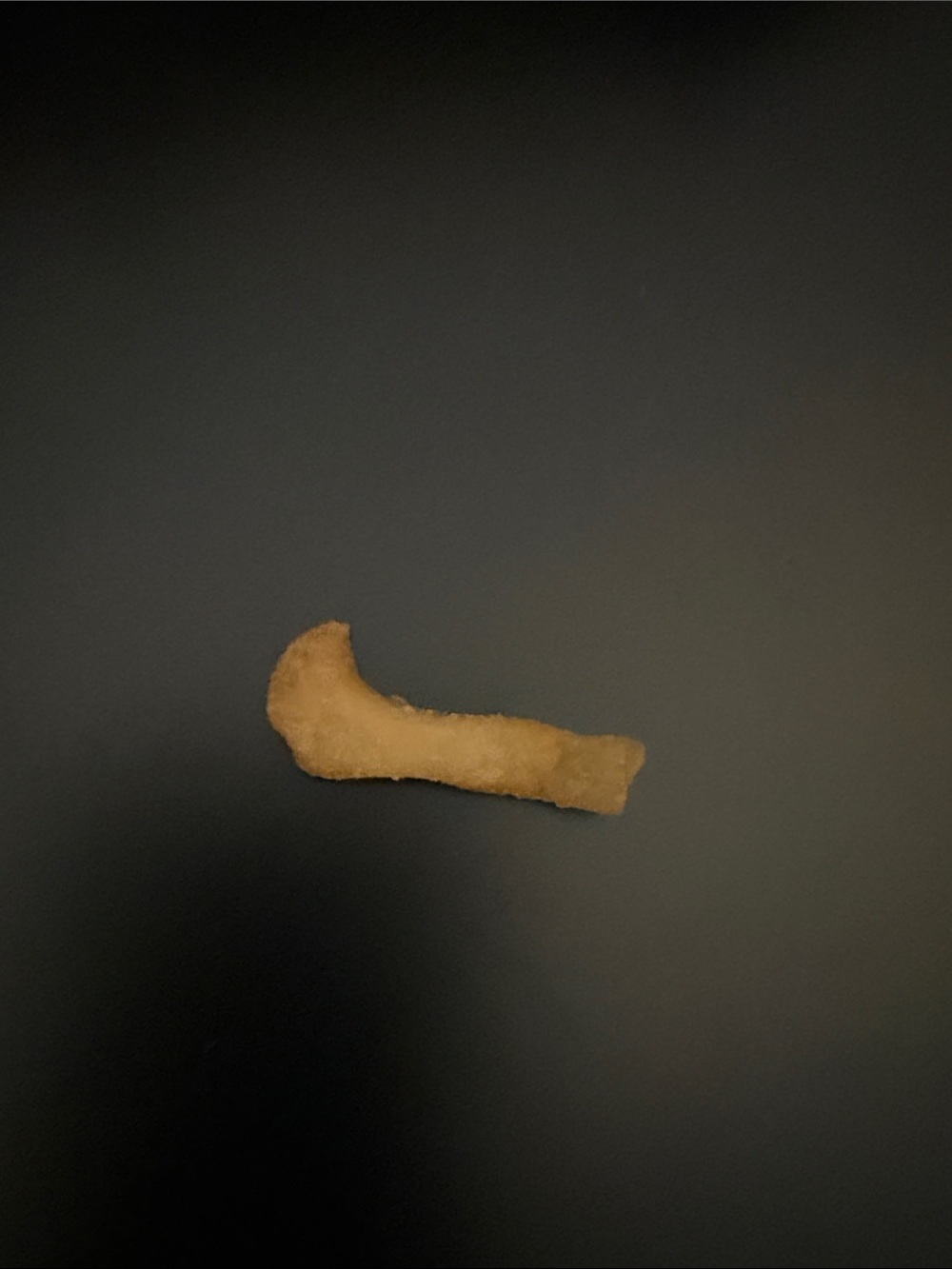 A French fry shaped like the Nike logo